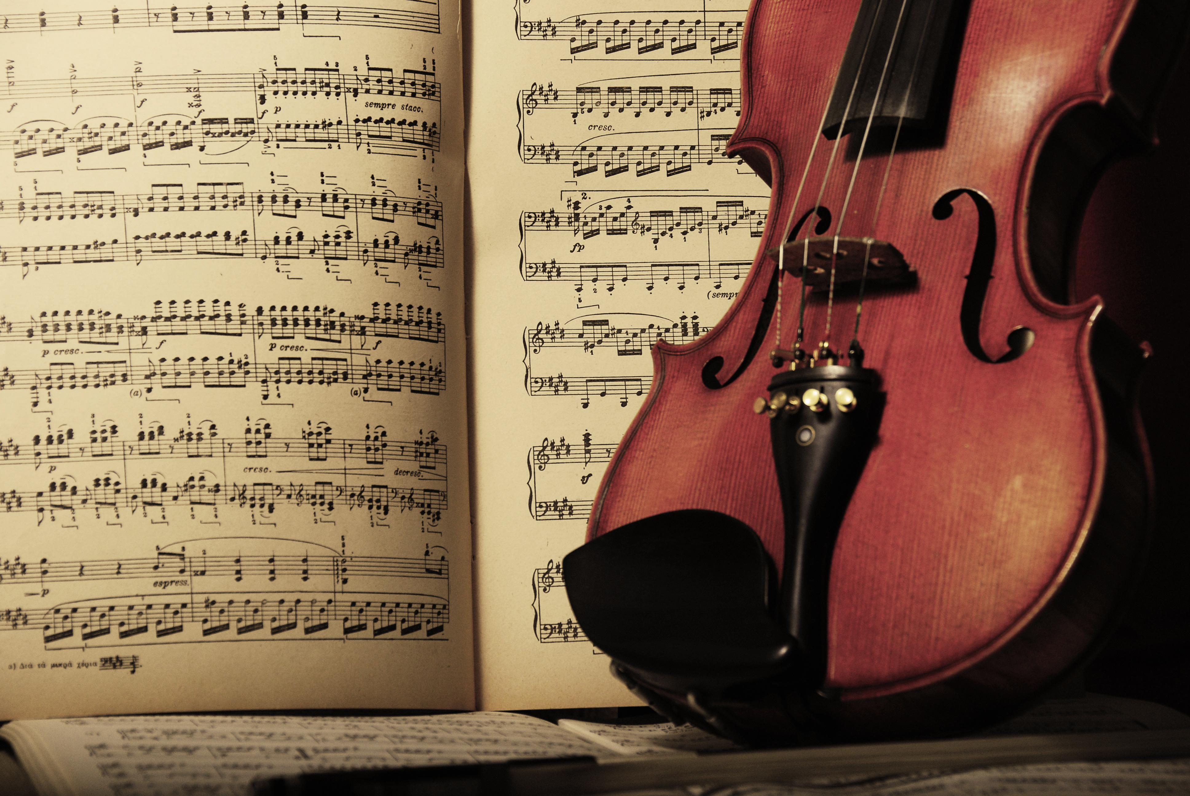 Violin Near A Sheet Of Music Notes